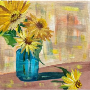 Sunflowers in a blue glass jar